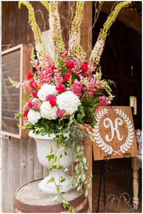 Urn filled with Eremurus, Protea, celosia, snapdragons, hydrangeas, roses, dahlias, eucalyptus, by the Garden by the Gate florists