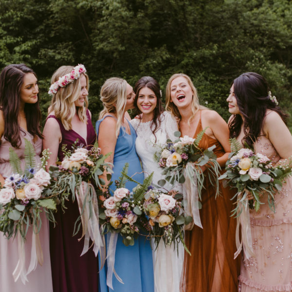 A boho wedding in the country features mis-matched bridesmaids bouquets and natural bouquets by Garden by the Gate Floral Design, Photo: Mallory + Justin Photography