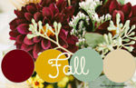 Fall wedding bouquet of burgundy dahlias, white roses, and sunflowers for a wedding at Firestone County Club