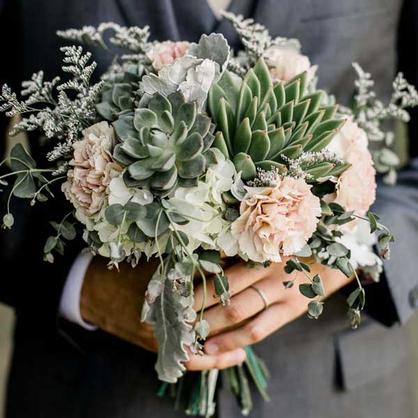 Succulent and antique carnation bouquet by Garden by the Gate Floral Design