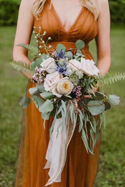 Garden roses and natural elements in a bridal bouquet by Garden by the Gate Floral Design. Photo by Mallory + Justin Photography