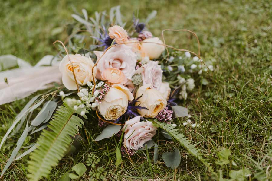 Garden roses and natural elements in a bridal bouquet by Garden by the Gate Floral Design. Photo by Mallory + Justin Photography. North Canton Wedding Florist