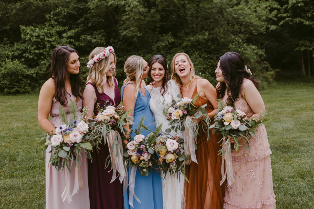 A boho wedding in the country features mis-matched bridesmaids bouquets and natural bouquets by Garden by the Gate Floral Design, Photo: Mallory + Justin Photography